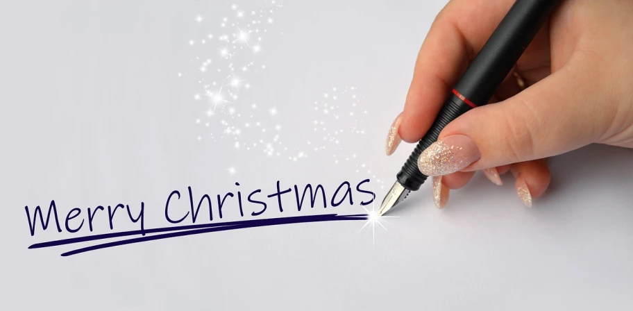 a person writing merry christmas on a piece of paper, realism, fountain pen, avatar image, advertising photo, background image