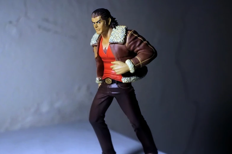 a close up of a figurine of a man, inspired by Yasutomo Oka, red shirt brown pants, doing a sassy pose, male vampire, katsuhiro