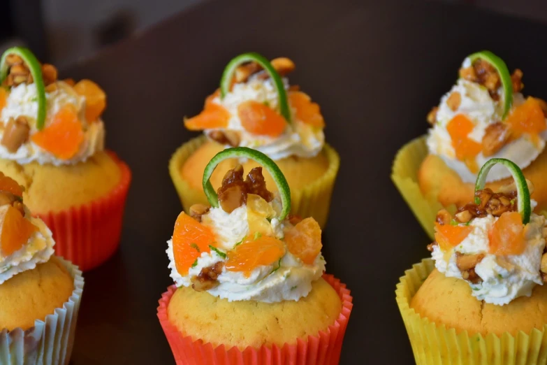 a bunch of cupcakes sitting on top of a table, inspired by Johannes Martini, orange slices, lime, gourmet cooking, high détails