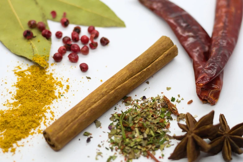 an assortment of spices and herbs on a white surface, a picture, by Juan O'Gorman, cinnamon, on a sunny day, close-up product photo, mid shot photo