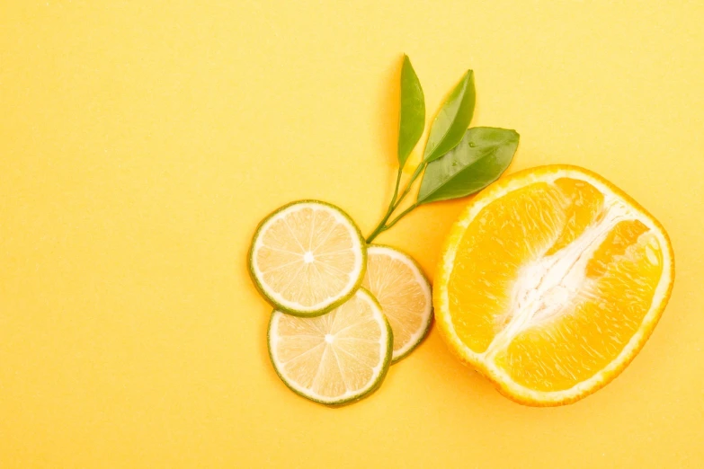 an orange and a slice of lime on a yellow background, photoshoot for skincare brand, facebook post, on a canva, clean and pristine design