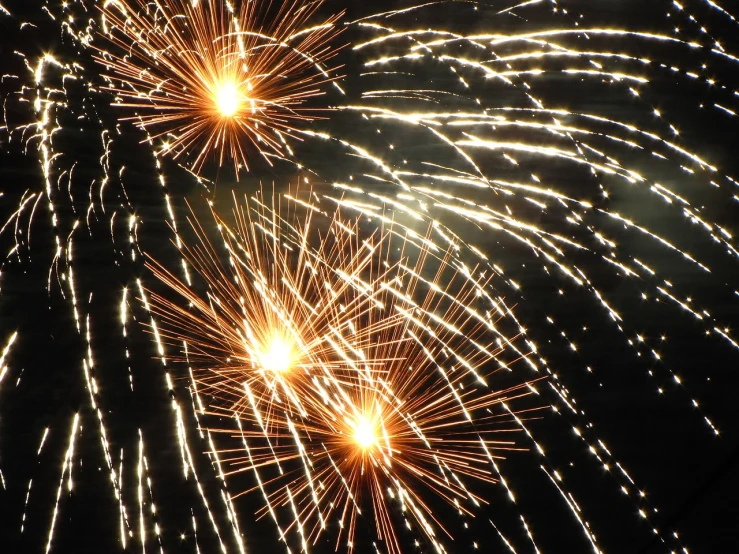 a group of fireworks lights up the night sky, istockphoto, welding torches for arms, usa-sep 20, sparkles and sun rays