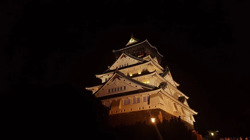 a tall clock tower lit up at night, a picture, by Torii Kiyomasu, flickr, scarry castle)). mystical, castles, projection mapping, сastle on the rock