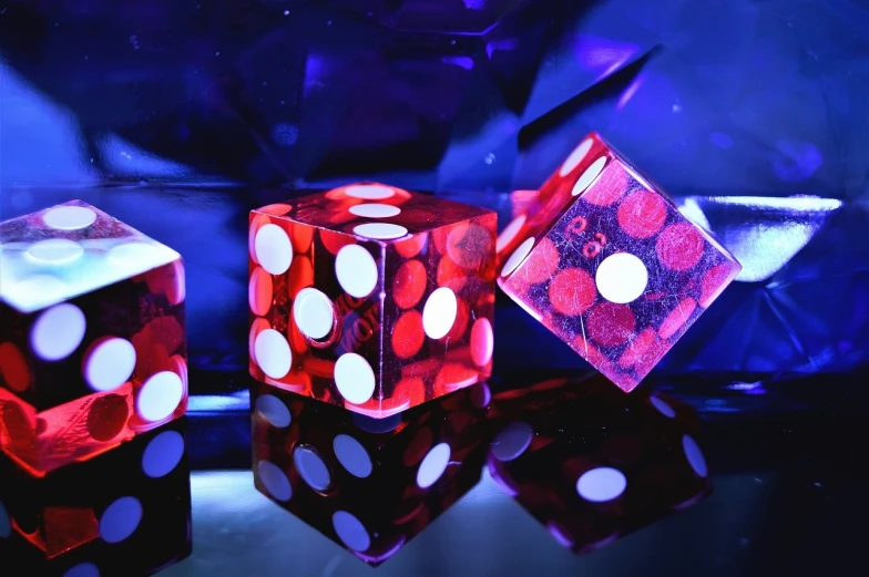 a couple of dice sitting on top of a table, crystal cubism, blue and red lighting, background image, casino, profile pic