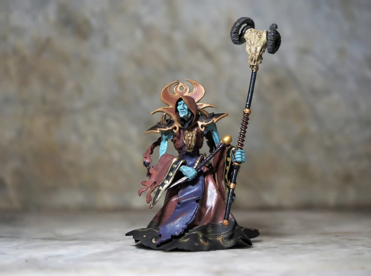 a close up of a figurine of a woman with a staff, by senior character artist, cloisonnism, nagash editorial, tzeentch, portrait mode photo