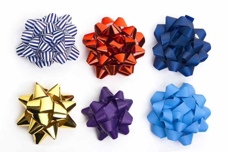 a close up of a bunch of bows on a white surface, a stock photo, by Karel Štěch, academic art, istockphoto, 6 colors, foil, 1990s 1992