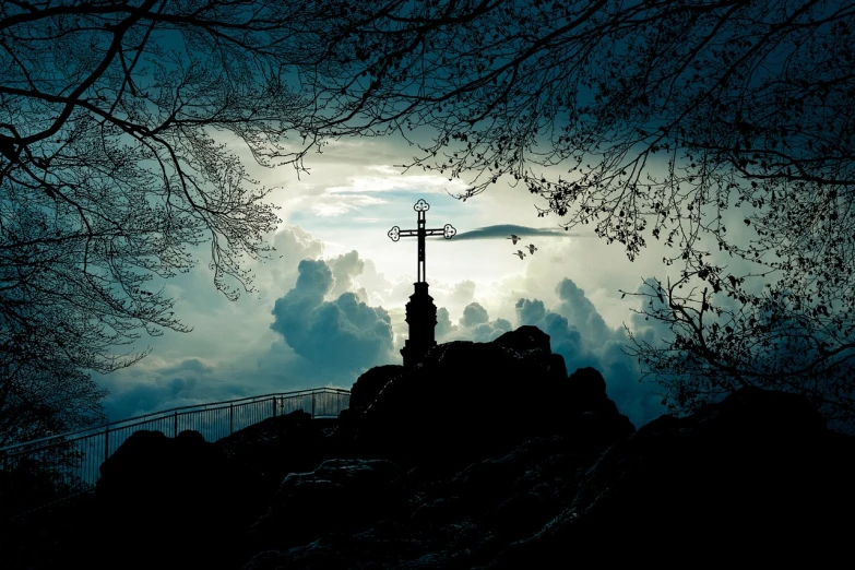 a cross is silhouetted against a cloudy sky, a picture, by Hristofor Žefarović, shutterstock, romanticism, torii in a moutain with trees, dark fantasy setting, ukraine. photography, cliffside