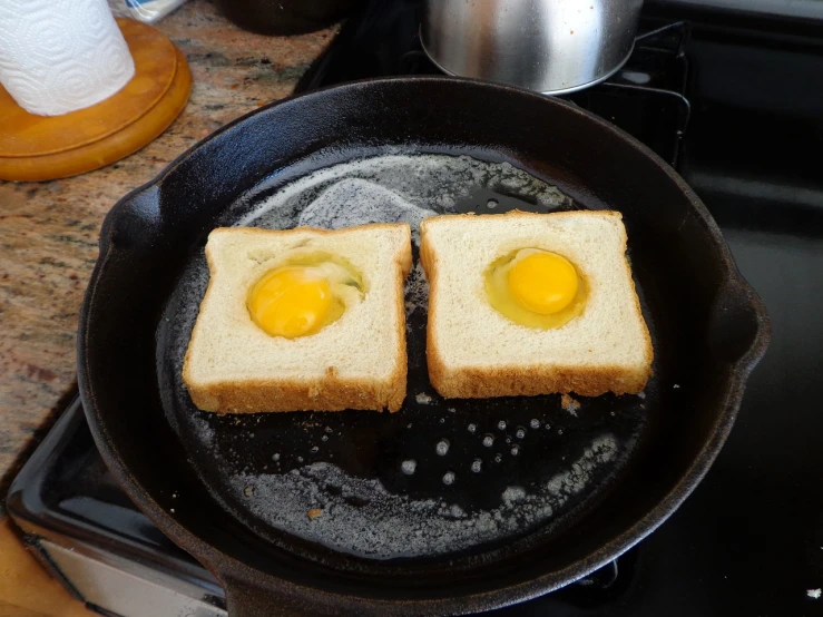 two pieces of bread with eggs in a frying pan, by Robert Brackman, flickr, precisionism, dragon eggs, chicago, blocking the sun, prototype