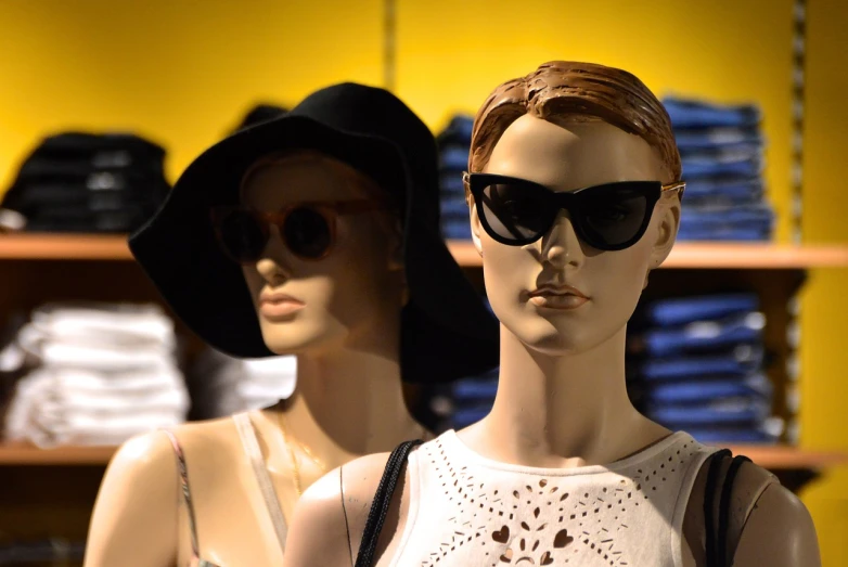 a couple of mannequins standing next to each other, a picture, by Bernie D’Andrea, pexels, big sunglasses, female face and bust, loosely cropped, hot topic