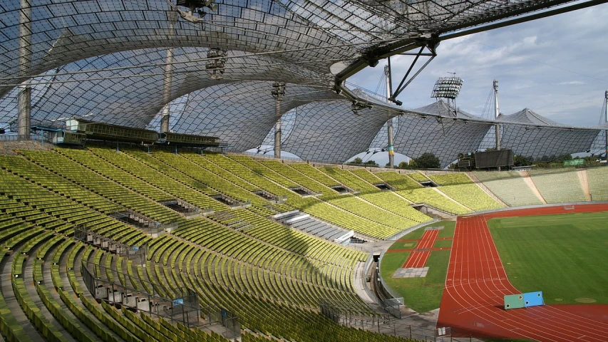 a stadium filled with lots of green seats, by Werner Gutzeit, flickr, norman foster, interior view, spielberg, australia