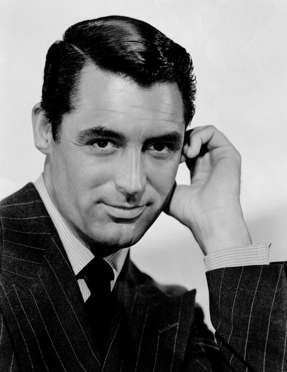 a black and white photo of a man in a suit, by Yousuf Karsh, pixabay, timothy dalton, arnold armitage, handsome girl, colorful ben day dots