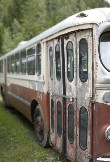 an old bus that is sitting in the grass, a portrait, by Jessie Algie, flickr, rusted panels, istock, bus station, file photo