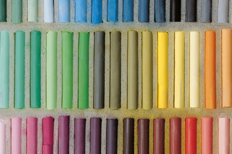 a close up of a bunch of crayon sticks, a pastel, color field, sand color, pastel colorful mold, black chalk, 3 5 mm colour