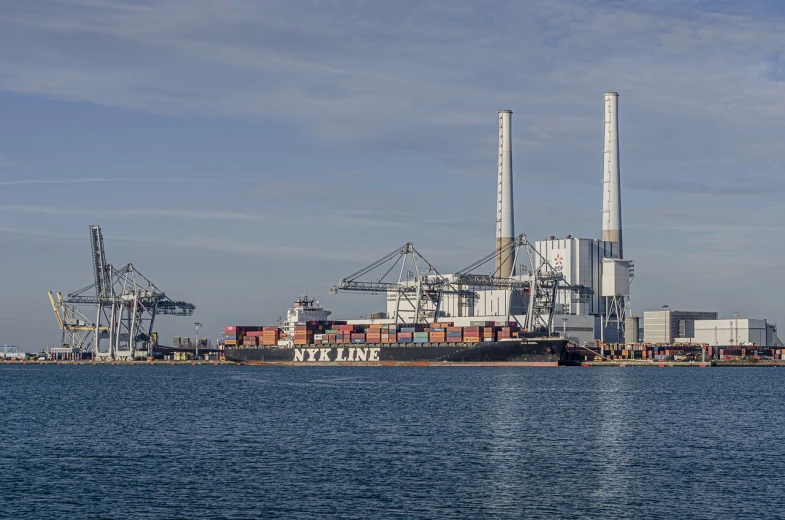 a large ship sitting in the middle of a body of water, by Richard Carline, industrial photography, highfleet, panorama, shot on 1 5 0 mm