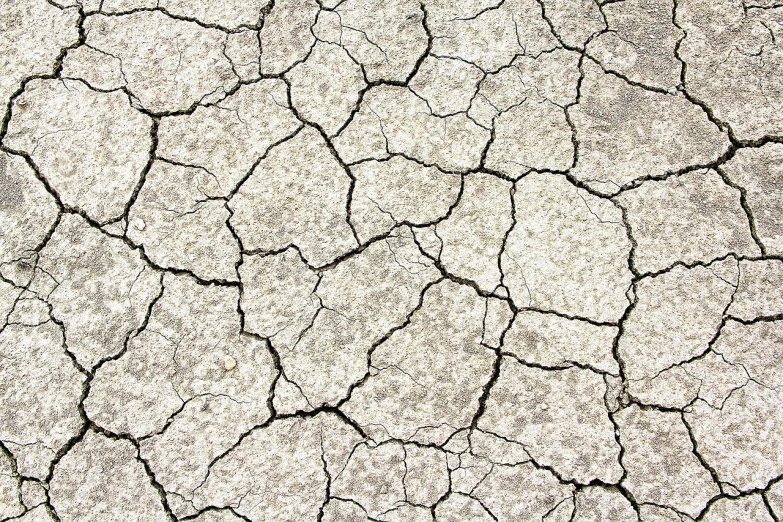 a close up of a crack in the ground, flickr, land art, illustration”, salt flats with scattered ruins, grain”, wallpaper”