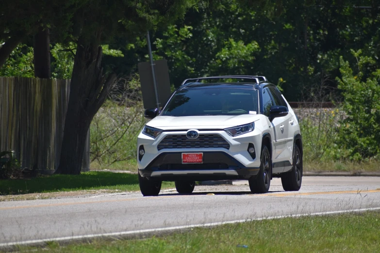 a white toyota rav parked on the side of the road, by Tom Carapic, happening, 2 0 2 2 photo, from wheaton illinois, square, driving