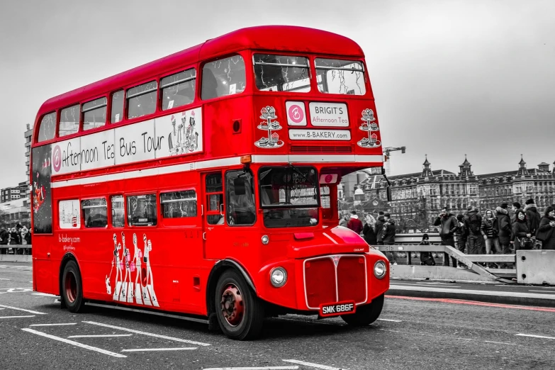 a red double decker bus driving down a street, a colorized photo, pixabay contest winner, black and white monochrome, god save the queen!!!, rob mcnaughton, red brown and white color scheme