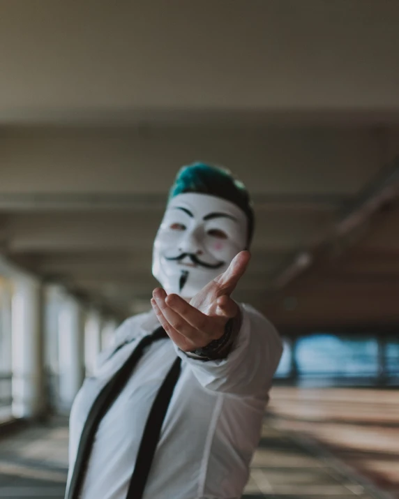 a man in a white shirt and tie with a mask on, unsplash, bitcoin evil, middle finger, julian ope, anonymous