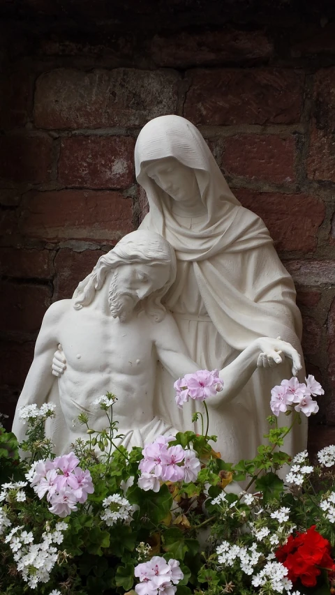 a statue of a woman holding a child, by Harry Haenigsen, flickr, romanticism, jesus on the cross, lostus flowers, with white skin, holywood scene
