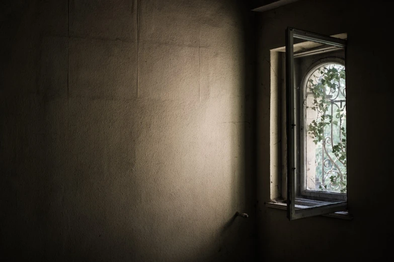 a light shines through a window in a dark room, inspired by Elsa Bleda, romanticism, abandoned ruins, with backlight, beige and dark atmosphere, 2 4 mm iso 8 0 0