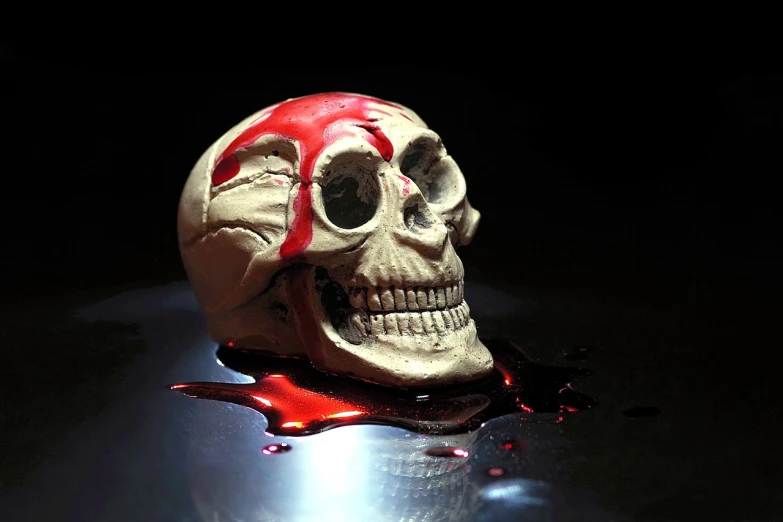 a skull sitting on top of a table covered in blood, a portrait, by Edward Corbett, pixabay, blood drop, really close - up shot, made of glowing wax and ceramic, profile picture