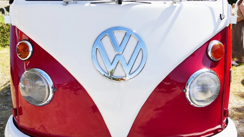 a close up of a red and white vw bus, trademarks and symbols, best on adobe stock, snapchat photo, wikimedia commons