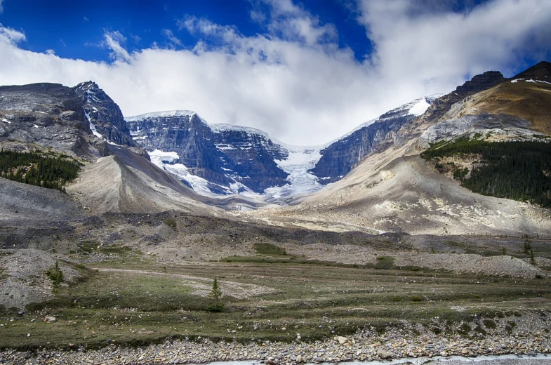 a view of a mountain range with a river in the foreground, a portrait, by Doug Wildey, flickr, glacier landscape, banff national park, mountains of ice cream, front facing!!!