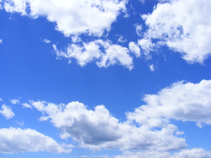 a man flying a kite on top of a lush green field, minimalism, beautifull puffy clouds. anime, panorama view of the sky, cumulus clouds, light blues