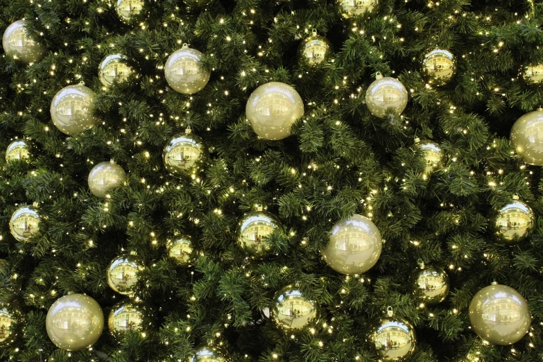 a close up of a christmas tree with ornaments, by Erwin Bowien, pixabay, baroque, lush tress made of city lights, seamless texture, golden orbs, outdoor photo