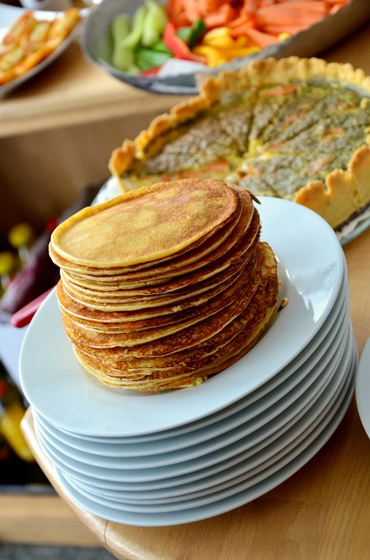 a stack of pancakes sitting on top of a white plate, a photo, by Aleksander Gierymski, shutterstock, breakfast buffet, many golden layers, high res photo, stock photo