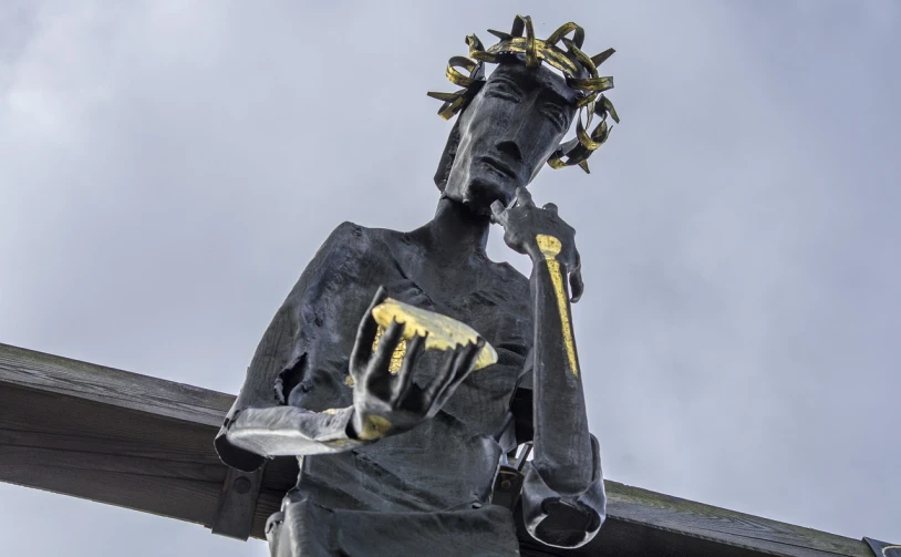 a statue of a man with a crown on his head, inspired by Sir Jacob Epstein, pikachu as jesus, crown of thorns, warwick saint, metal jaw