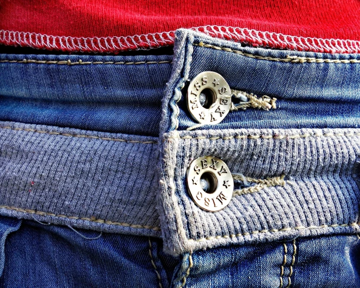 a close up of the back pocket of a pair of jeans, a stock photo, pixabay, red tank top and wide blue pants, button eyes, pierced navel, highly detailed image