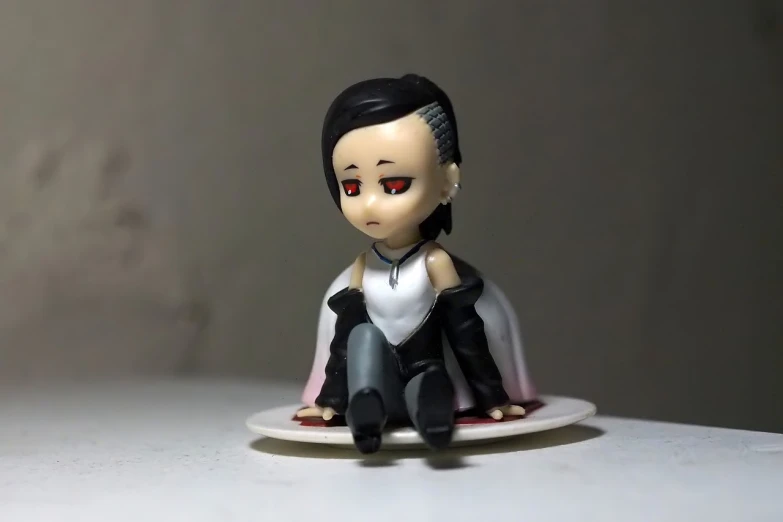 a small figurine of a woman sitting on a plate, inspired by Nara Yoshitomo, tumblr, male vampire of clan banu haqim, an anime nendoroid of elon musk, aeon flux style, zezhou chen