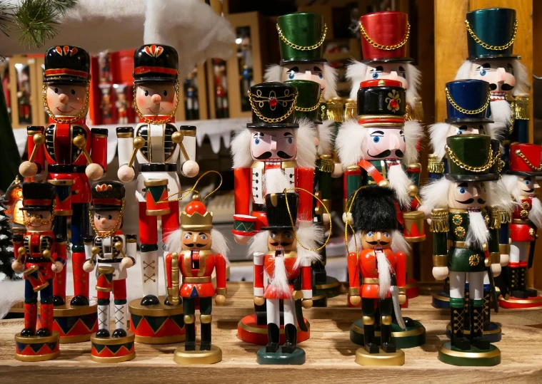 a group of nutcrackers sitting on top of a table, by Sigmund Freudenberger, shutterstock, folk art, inside an old weapon shop, red black white golden colors, 2 4 mm iso 8 0 0 color, 🦩🪐🐞👩🏻🦳