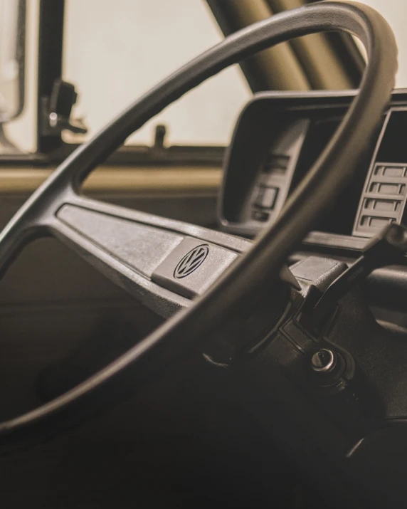 a close up of a steering wheel in a vehicle, unsplash, renaissance, vw microbus driving, banner, historical image, hero shot