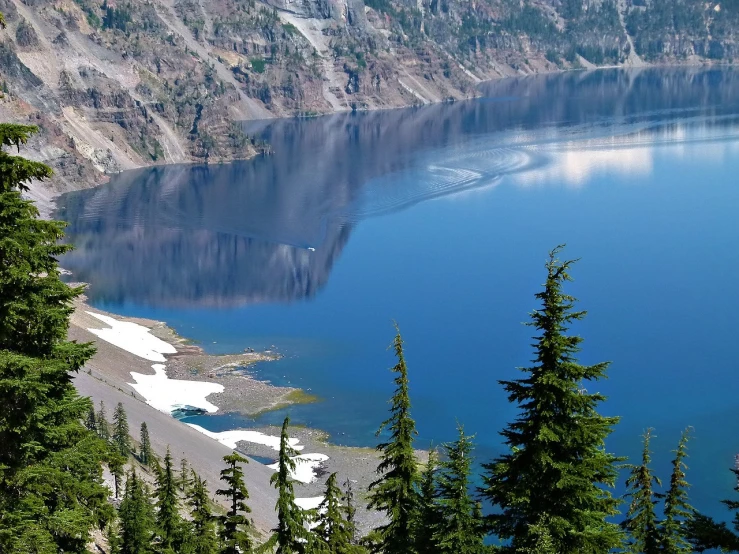 a large body of water surrounded by trees, a picture, by Jim Nelson, crater lake, shades of blue and grey, usa-sep 20, high deatil