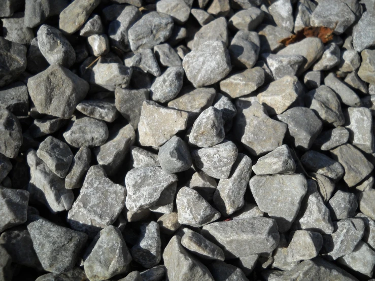 a pile of rocks sitting next to each other, a macro photograph, wallpaper!, stone roads, illinois, grain”