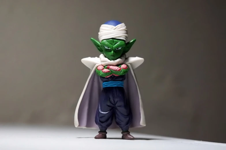 a close up of a toy on a table, a picture, sōsaku hanga, fullbody photo, dbz, goblin, portrait mode photo