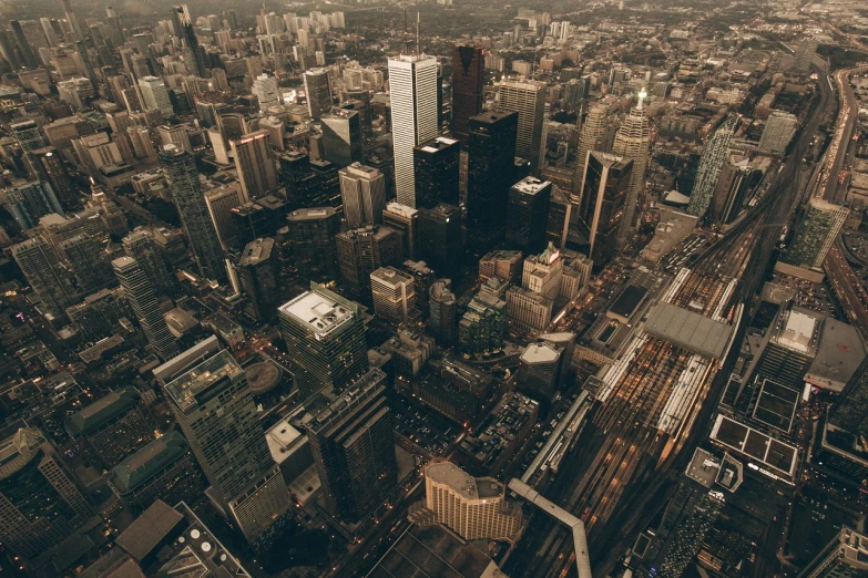 an aerial view of a city at night, pexels contest winner, toronto, buildings covered with greebles, day cityscape, grain”