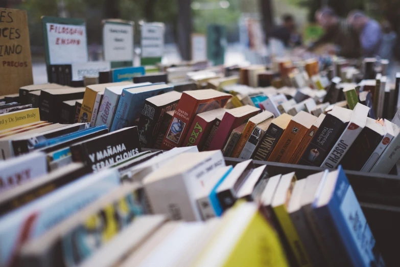 a bunch of books that are on a table, pexels contest winner, market, 8k 50mm iso 10, small library, instagram photo