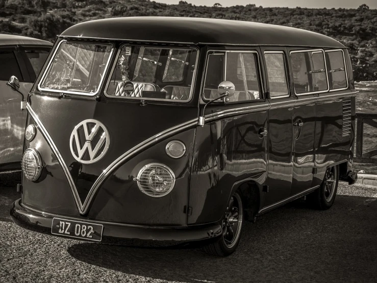 a black and white photo of a vw bus, a black and white photo, unsplash, retrofuturism, sepia, australia, tonemapped, triumphant