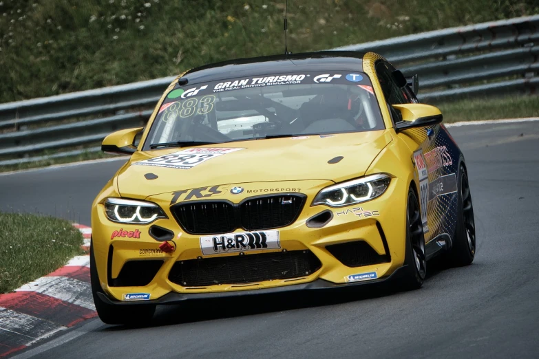 a yellow bmw car driving on a race track, by Jakob Gauermann, tag, hill, # 2 2 3 3 e 6, kimi vera