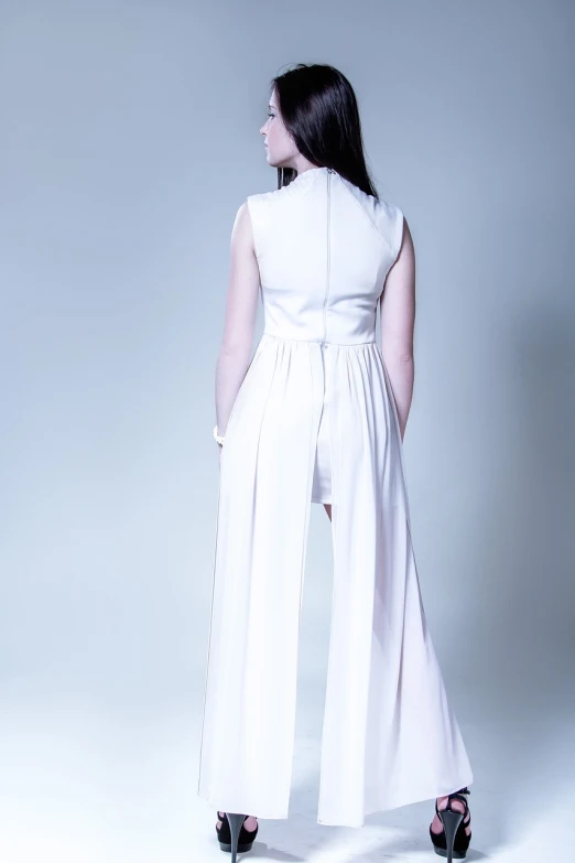 a woman in a white jumpsuit posing for a picture, a pastel, inspired by Marina Abramović, tumblr, bauhaus, back view. nuri iyem, white royal dress, product introduction photo, high key detailed