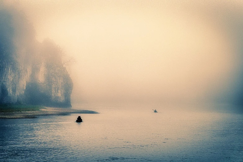 a person in a boat on a body of water, a photo, flickr, tonalism, foggy landscape, rivers, couple, lone person in the distance