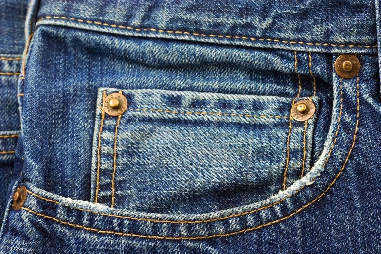 the back pocket of a pair of jeans, a stock photo, high resolution and detail, golden detailing, ultra - details, incredible hd detail