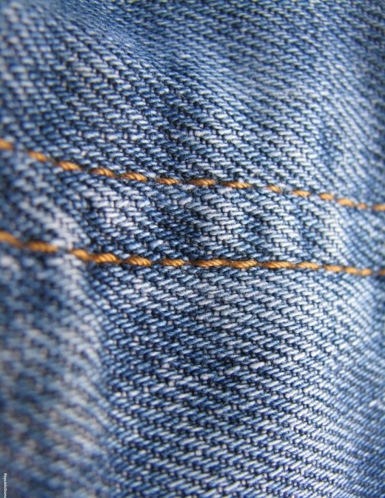 a close up of a pair of blue jeans, a macro photograph, pexels, lined in cotton, shot on kodak vision 200t, golden thread, rust