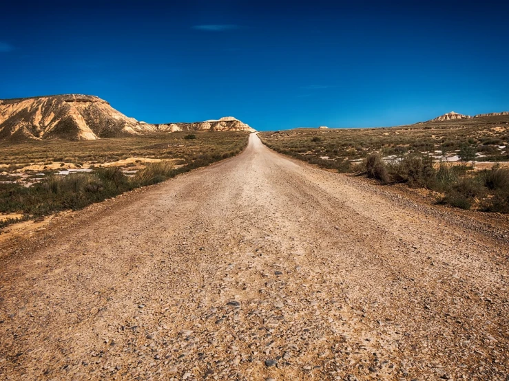 a dirt road in the middle of a desert, by Thomas Häfner, les nabis, limestone, 12mm wide-angle, old west, amber