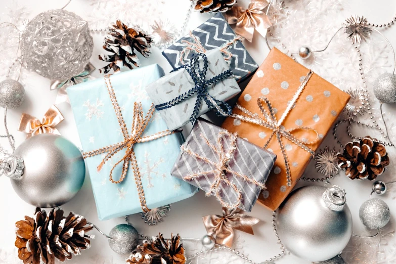 a pile of presents sitting on top of a table, light grey blue and golden, silver and blue colors, packshot, thumbnail