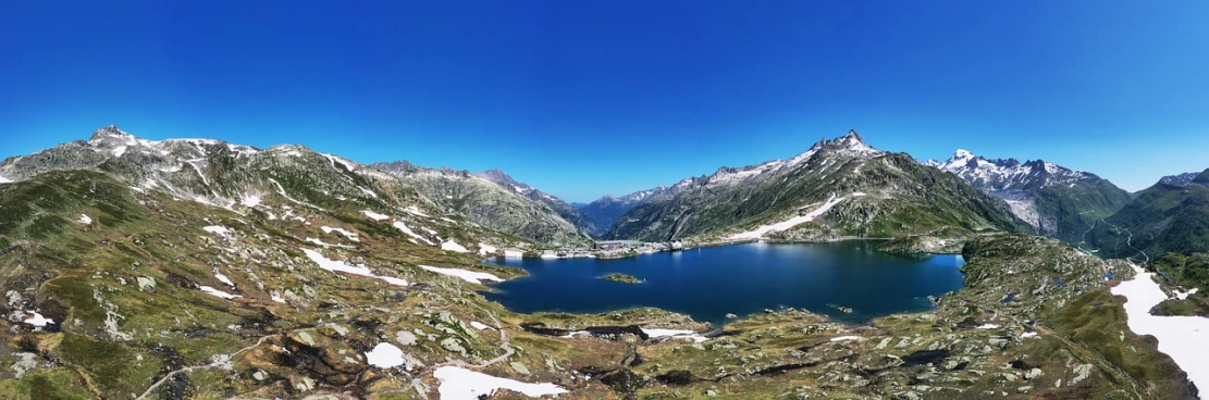 a large body of water surrounded by mountains, by Werner Andermatt, pexels contest winner, les nabis, panorama view, atlach - nacha, snapchat photo, whistler