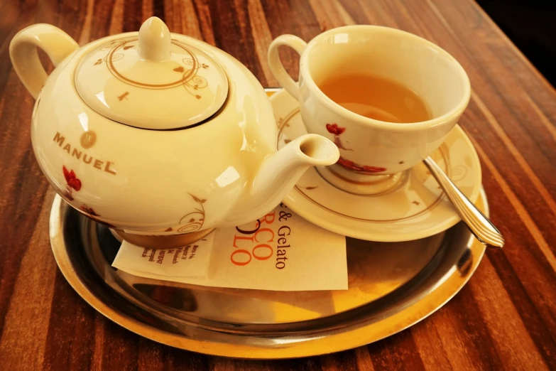 a white tea pot sitting on top of a silver tray, by Kume Keiichiro, rococo, hot cocoa drink, choo choo, in tokio, not cropped